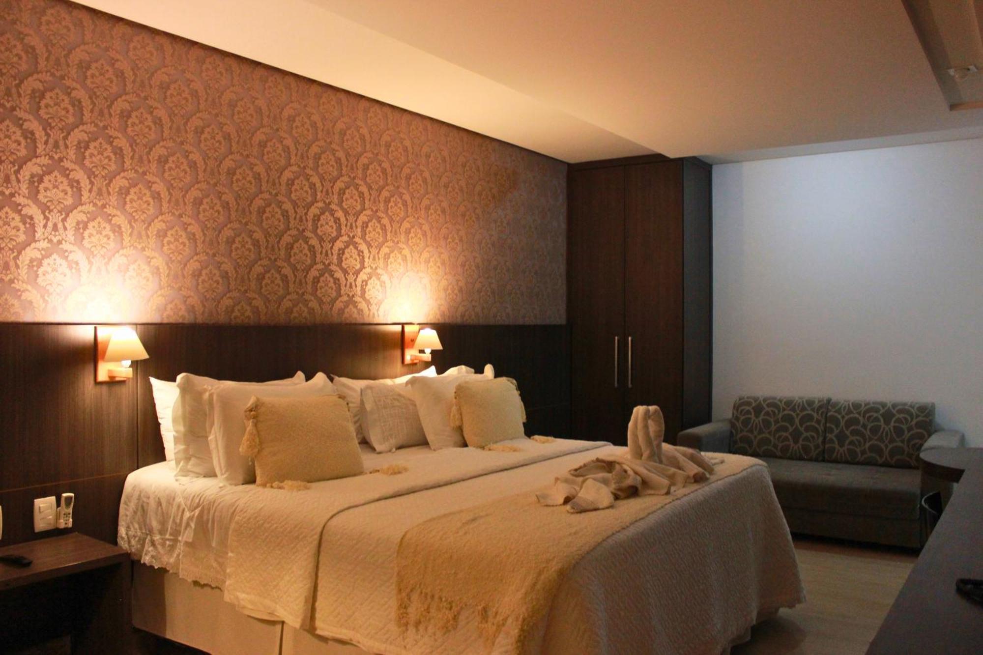 Gontijo Inn Hotel Itajubá Zewnętrze zdjęcie A bedroom in a hotel